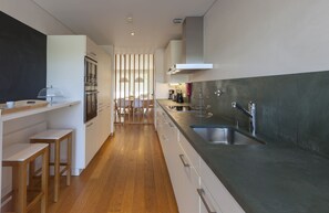 Fridge, coffee/tea maker, cookware/dishes/utensils