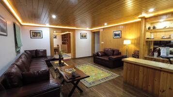 3BHK Chalet | Living area | 55-inch TV with cable channels