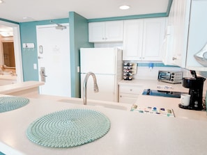 Fridge, microwave, stovetop, coffee/tea maker