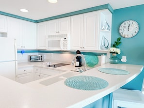 Fridge, microwave, stovetop, coffee/tea maker