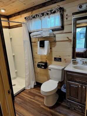 Shower, towels, soap, toilet paper