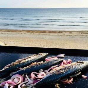 On the beach, sun-loungers, beach towels