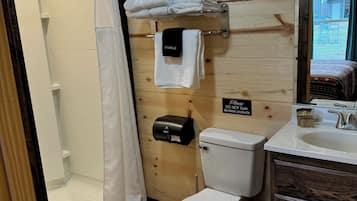 Shower, towels, soap, toilet paper