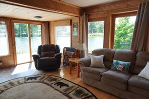 Smart TV - Welcome to Serenity Shores! 🌅 Soak in the private hot tub, unwind by the fire pit 🔥, and savor calming lake views. Pet-friendly 🐾 and perfect for recharging, exploring, and making memories. (South Boardman)