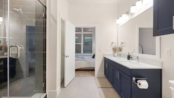 Shower, hair dryer, towels, soap