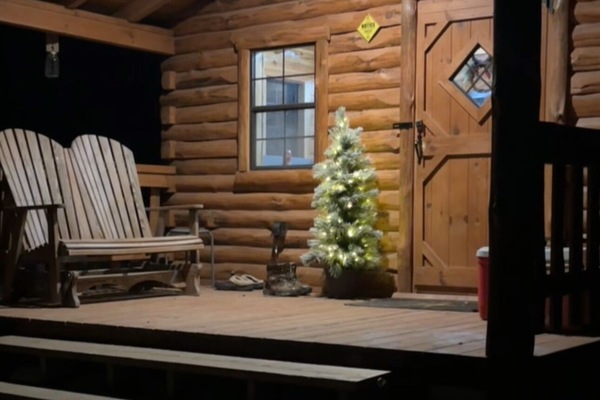 “A welcoming porch dressed for the holidays at Haan Hollow.”
