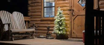 Charming one-room cabin retreat with private bath, kitchenette and log gazebo.