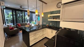 Apartamento Deluxe, patio | Cocina privada