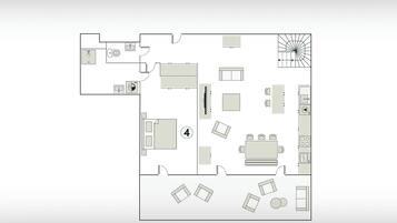 A floor plan of a loft apartment with a kitchenette, a dining area, a living room, and a small bathroom.