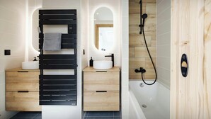 A modern bathroom with two sinks, a black towel rack, a wooden vanity, a mirror, and a shower with a wooden panel wall.