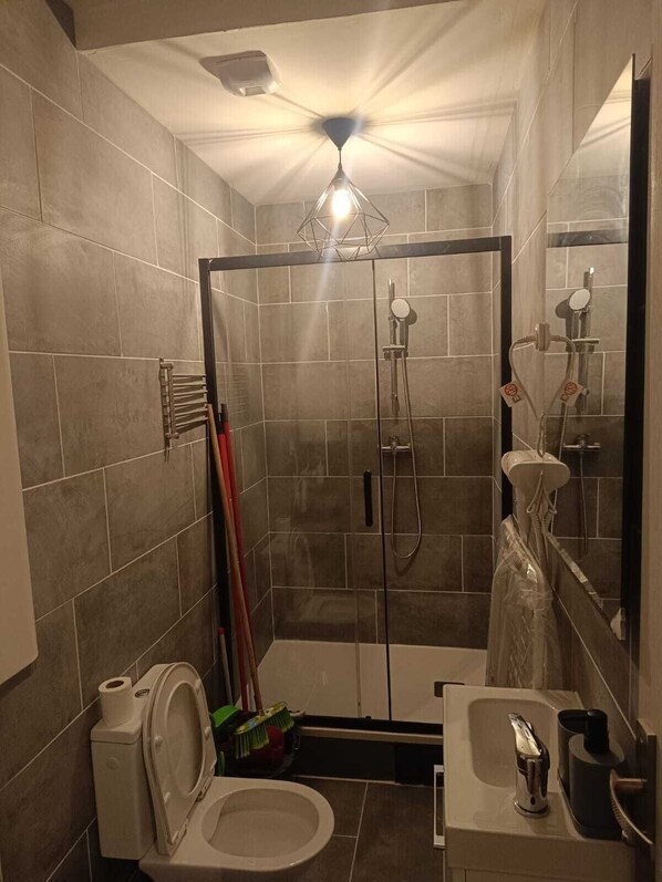Shower, hair dryer, towels, soap