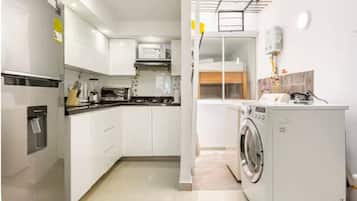 Fridge, microwave, stovetop, coffee/tea maker