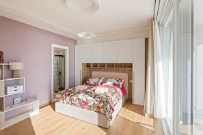 A thoughtfully designed bedroom offering space, light, and a calm coastal feel.