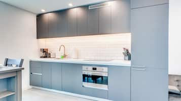 Deluxe Condo, Balcony, City View | Private kitchen | Full-size fridge, microwave, oven, stovetop