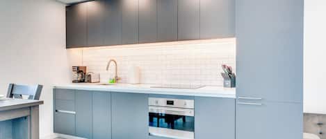 Deluxe Condo, Balcony, City View | Private kitchen | Full-sized fridge, microwave, oven, stovetop