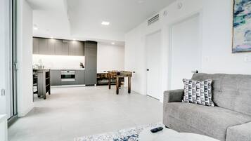 Deluxe Condo, Balcony, City View | Living area