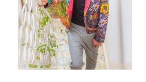 A person walking down a corridor with a colorful jacket and grey pants. - 5-bedroom bed & breakfast in phenomenal Marrakech with AC (Marrakech)