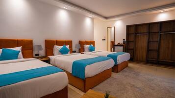 Deluxe Triple Room, City View | In-room safe, iron/ironing board, free WiFi