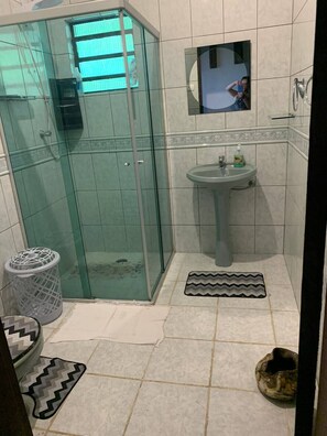 Shower, hair dryer, soap, toilet paper