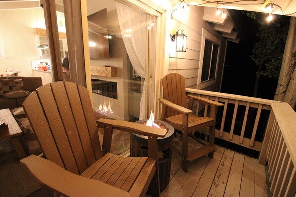 A wooden deck with Adirondack chairs and a fire pit. - Cozy 4BR Mountain Escape Sleeps 12 Mountain Escape w'Views (Mammoth Lakes)