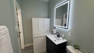 Hair dryer, towels, soap, shampoo