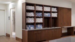 A modern kitchen with wooden cabinets and a built-in sink. - Marriott Vacation Club, Waikiki (Studio) (Honolulu)