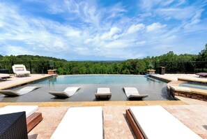 Outdoor pool, a heated pool - Luxurious 8-bedroom mountain resort with infinity pool, fire pit & much more (Talking Rock)