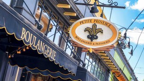 A storefront with a sign reading "PETITE PROVENCE BOULANGERIE & PATTISSERIE". - Alberta Arts-tastic Mother-In-Law Suite (Portland)