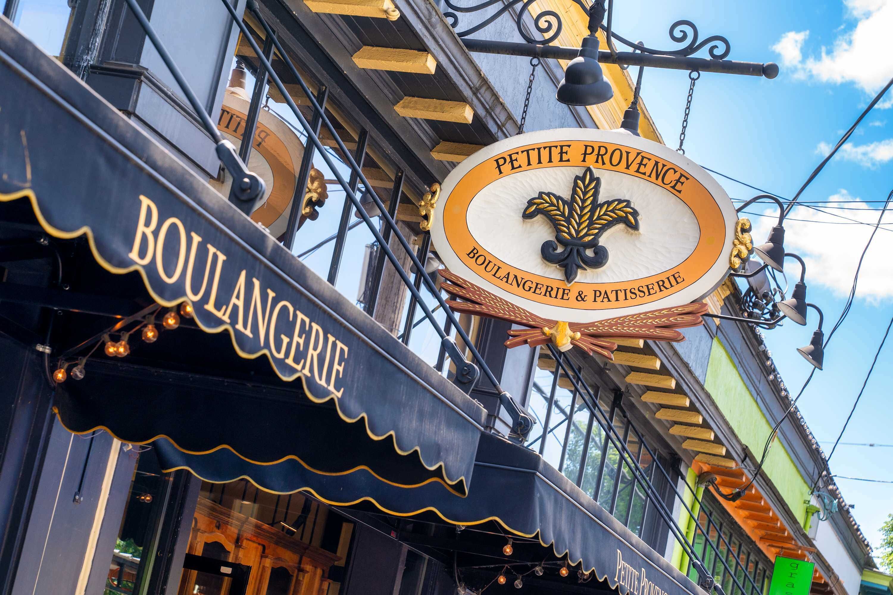 A storefront with a sign reading "PETITE PROVENCE BOULANGERIE & PATSISSERIE".