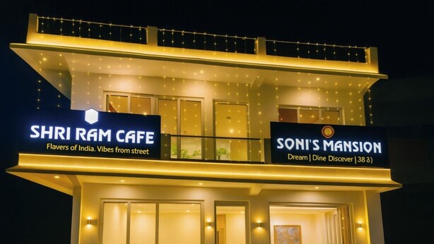 A two-story building with signs for 'SHRI RAM CAFE' and 'SONI'S MANSION'.