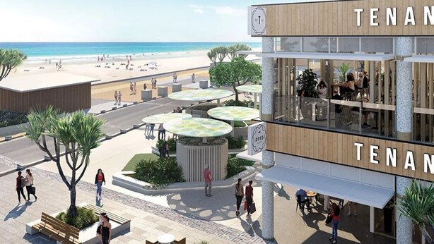Un edificio moderno con la señalización "TENAN", mesas al aire libre y vistas a la playa.