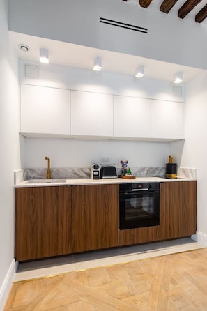 Oven, coffee/tea maker, toaster, cookware/dishes/utensils