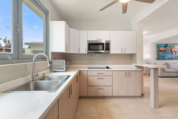 Fridge, microwave, stovetop, coffee/tea maker