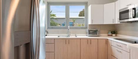 Fridge, microwave, stovetop, coffee/tea maker