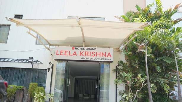 The entrance of Hotel Grand Leela Krishna with a covered entrance and potted plants. - Hotel Grand Leela Krishna  (Bhimavaram)