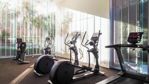 A gym with stationary bikes, treadmills, and a rowing machine. - Sea View-high Floor 2 Bed Room Excellent Location (Pattaya)