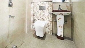 A bathroom with a shower, toilet, and sink. - OPO MINISTAR M180 (Gurugram)