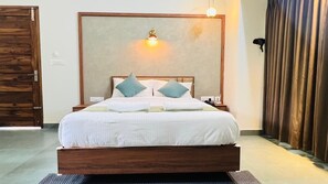 Deluxe Cottage, Balcony, Hill View | In-room safe, desk, soundproofing, iron/ironing board