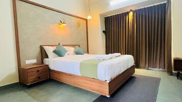 Deluxe Cottage, Balcony, Hill View | In-room safe, desk, soundproofing, iron/ironing board