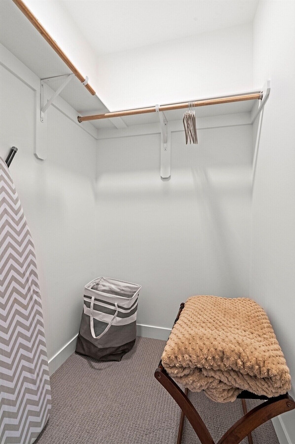 Enjoy easy organization with a large closet, luggage bench, and added conveniences for a seamless stay.