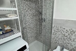 Hair dryer, towels, soap, shampoo