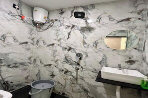 Separate tub and shower, rainfall showerhead, free toiletries