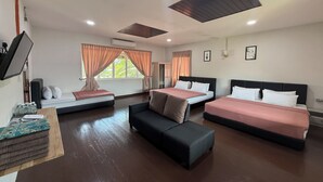 A hotel room with three beds, a sofa, and a TV. - Inapan Taman Herba (Kepala Batas)