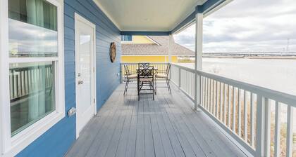 Escape to this serene 3-bedroom bayfront retreat in Seabrook Shores. Featuring stunning water views, a spacious deck for sunsets, and cozy coastal interiors, this hideaway is perfect for family getaways or a peaceful escape by the bay