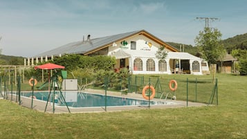 Seasonal outdoor pool, pool umbrellas, lifeguards on site