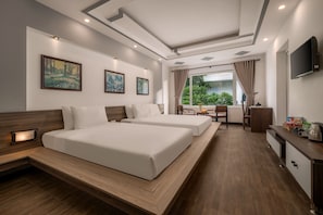 Deluxe Triple Room, Balcony, Pool View | Desk, laptop workspace, blackout drapes, free WiFi