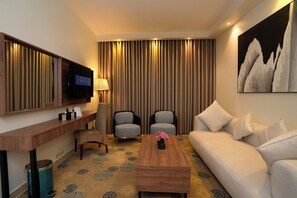 Junior Suite, 1 King Bed, Kitchenette, Executive Level | Living area | Flat-screen TV