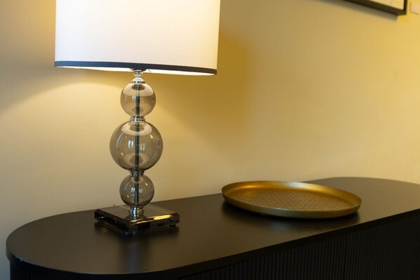 A table with a lamp and a tray.