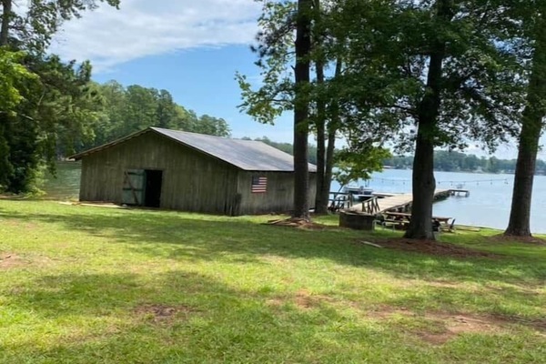 The original 1950's boathouse is equipped with canoe, kayak, and fishing rods