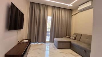 Appartement Deluxe, 3 chambres, balcon, vue ville | Coin séjour